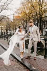 Couple walking down the street during the photoshoot in Amsterdam