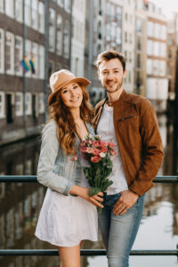 Lovely smiling couple posing for a couple photographer in Amsterdam