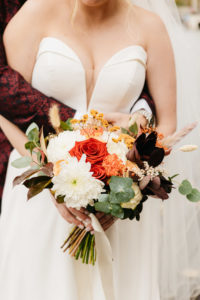 Flower bridal bouquet picture with red and autumn colours. photo made for the wedding photoshoot in Amsterdam.