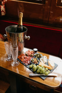 Snacks plate with champagne for the wedding on the boat in Amsterdam