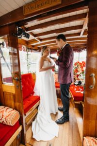 Wedding in Amsterdam on the boat. Couple stays in salon boat and exchange vows. Amsterdam elopement is a very beautiful event.