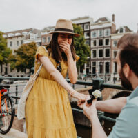 Surprise proposal on Reguliersgracht in Amsterdam captured by a professional photographer